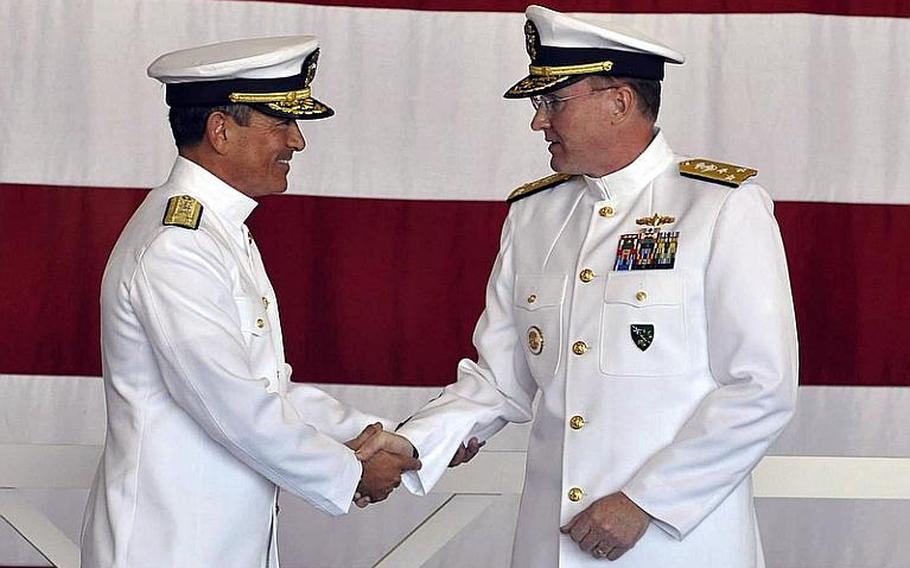 Navy 6th Fleet commander Vice Adm. Frank C. Pandolfe, right, shakes hands with outgoing commander Vice Adm. Harry B. Harris, Jr. during a change of command ceremony in Naples, Italy in October.