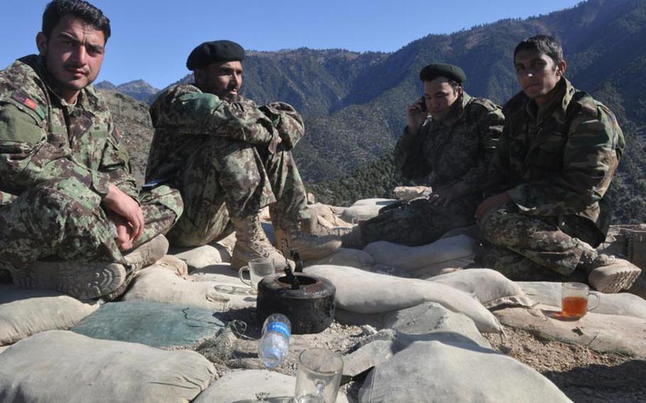 Afghan soldiers convene for afternoon tea at Observation Point Mace, an outpost in northern Kunar province that U.S. forces turned over to the Afghan military last year.