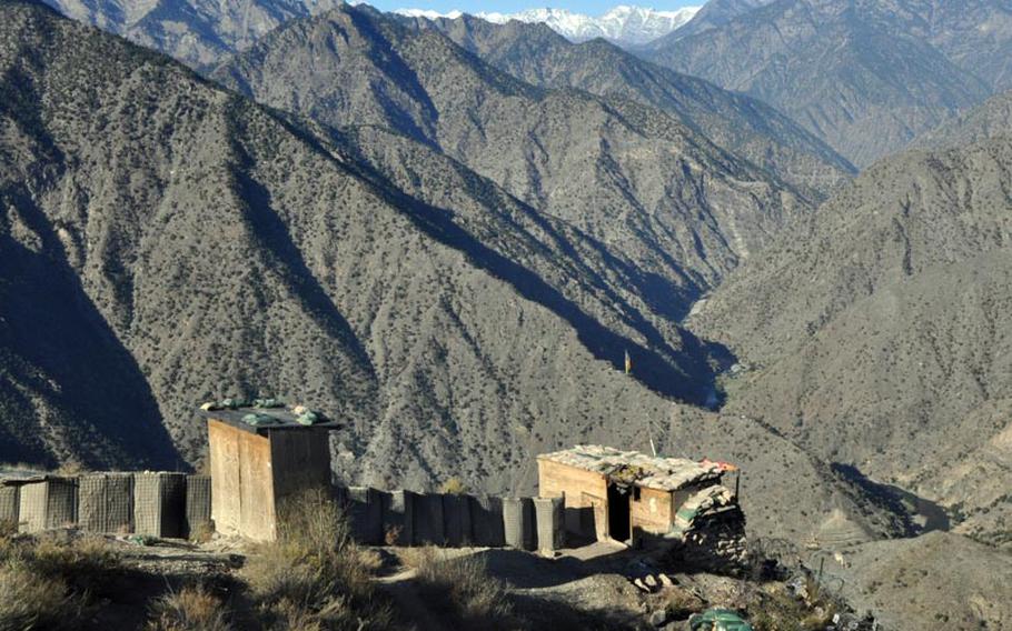 Snow-capped peaks in the Hindu Kush mountains loom in the distance beyond Observation Point Mace, an outpost in northern Kunar province occupied by the Afghan National Army.