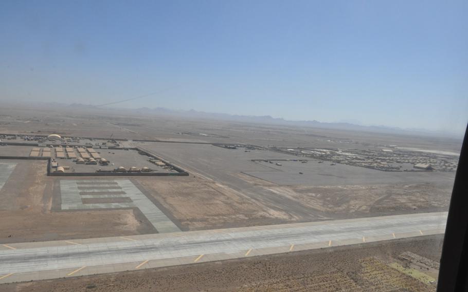 Shindand Air Base, a portion of which is seen from the open door of a Black Hawk in flight, is the second-largest coalition forces airfield in Afghanistan and home to the nation's fledgling Air Force Academy.