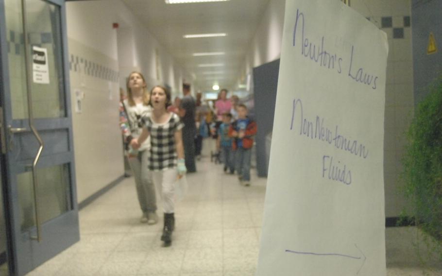 Students visit exhibits at Thursday's Math, Science, Technology Night at Hohenfels Middle/High School.