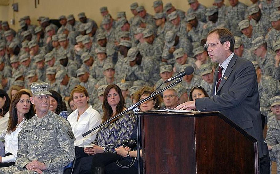 Peter Lang, the mayor of the city of Baumholder, spoke Wednesday at an uncasing and award ceremony for the 170th Infantry Brigade Combat Team. Looking on, from the front row, was brigade commander Col. Patrick Matlock. The mayor has expressed his desire to see a military community endure at Baumholder.