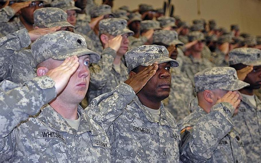 Soldiers with the 170th Infantry Brigade Combat Team salute during an uncasing ceremony at Baumholder Wednesday. The ceremony could mark the last time an infantry unit uncases its colors at Baumholder, as the 170th is scheduled to deactivate in October as part of larger military restructuring in the Defense Department.