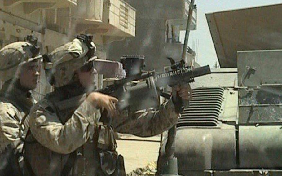 Former Marine Shaun Valdivia, holding weapon, conducts operations in Ramadi, Iraq, in 2006. Valdivia now works at the Jacksonville, Fla.-based Veterans Farm, which employs injured veterans. The farm is a finalist in Walmart&#39;s "Get on the Shelf" contest.