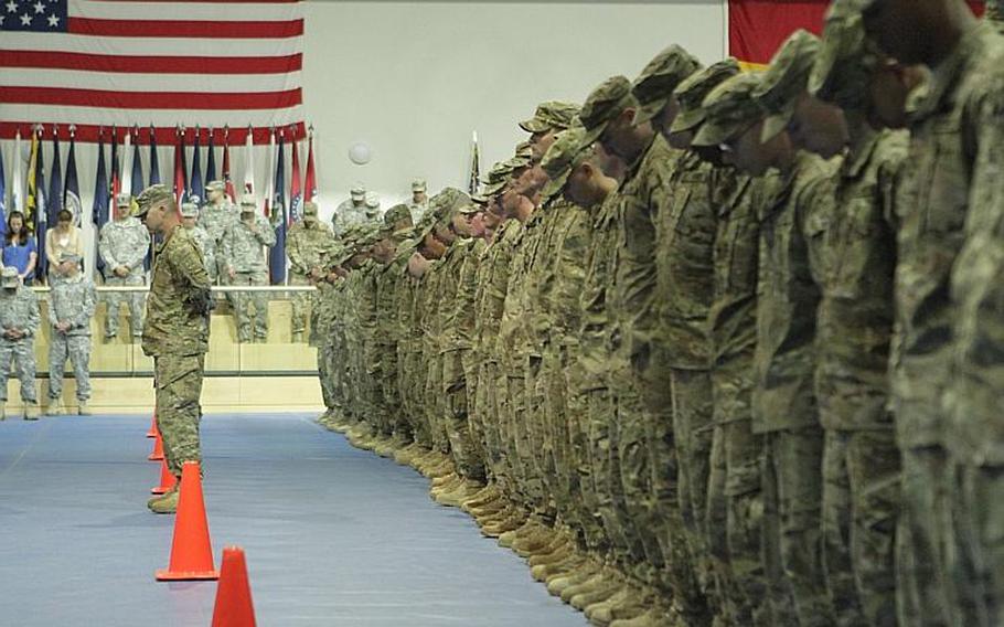 Soldiers with the 172nd Separate Infantry Brigade stand in formation during a prayer at a return ceremony for several hundred members of the brigade, held Friday in Grafenwoehr, Germany. Several hundred soldiers returned to both Grafenwoehr and Schweinfurt, as the brigade ends a 12-month tour in Afghanistan.