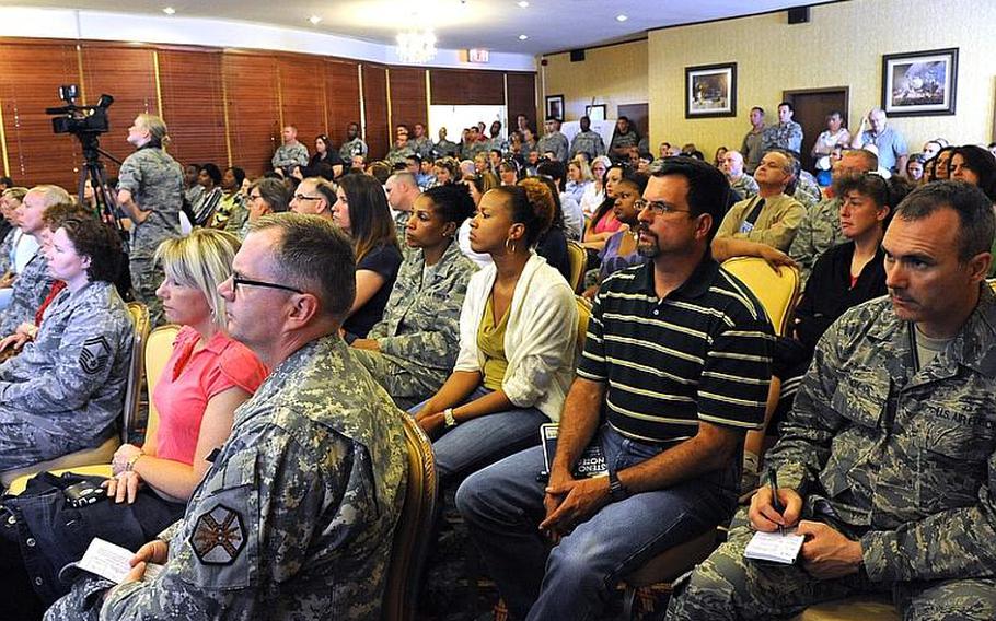 Town hall attendees listen to Lt. Gen. Craig Franklin, commander of the Kaiserslautern Military Community and 3rd Air Force, talk about actions taken following reports of attempted abductions and child molestations in the Kaiserslautern Military Community.
