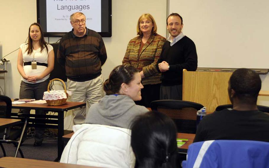 Instructors from the Airman and Family Readiness Center and family advocacy introduce themselves to attendees of the Happy Couple's class at Misawa Air Base on March 1, 2012. The purpose of the Happy Couple's class is to help strengthen marriages and relationships.