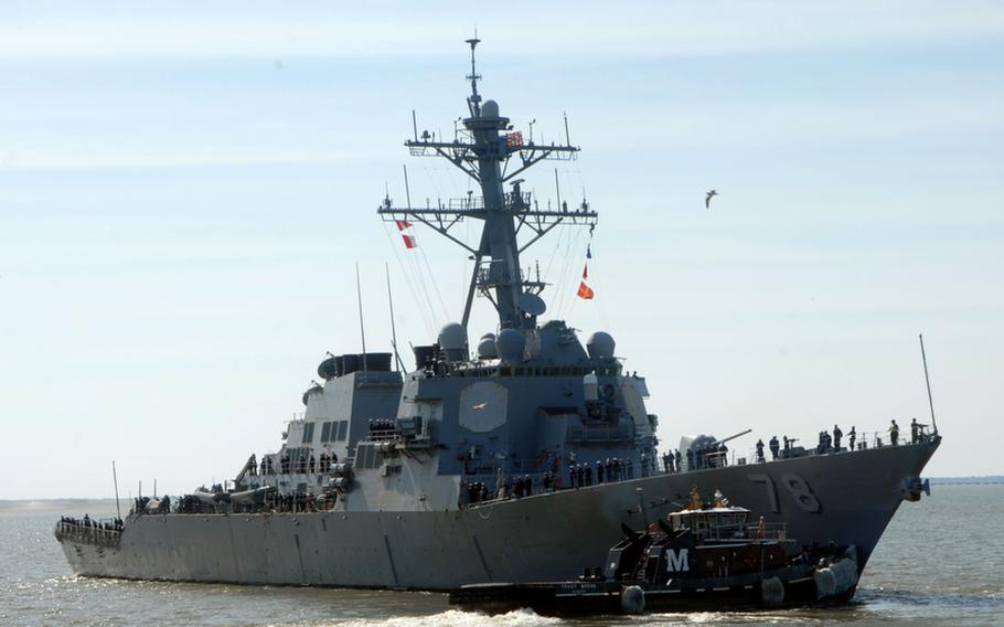Tugboats assist the guided-missile destroyer USS Porter as it departs Naval Station Norfolk, Va., in March. The Government Accountability Office is questioning the Navy&#39;s analysis of cost savings in the service&#39;s decision to base the Porter and three other ships in Rota, Spain.
