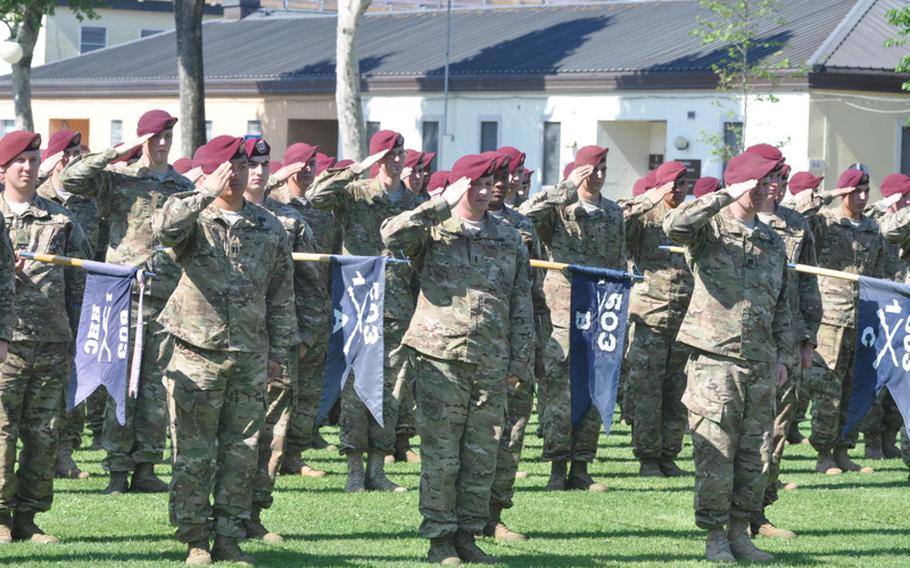 Soldiers from the 1st Battalion, 503rd Infantry Regiment offer salutes Thursday during a ceremony at Caserma Ederle that featured the casing of the colors for the 173rd Airborne Brigade Combat Team. The ''Sky Soldiers'' are getting set to start a nine-month deployment in Afghanistan.