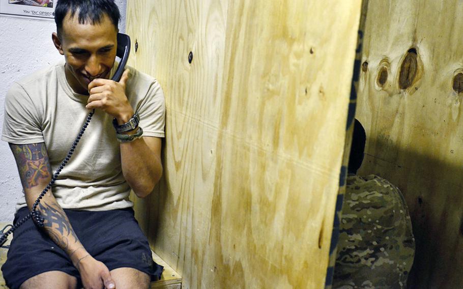Staff Sgt. Damian Remijio calls his girlfriend in Alaska earlier this year from the Morale, Welfare and Recreation room at Combat Outpost Sabari, Khost province. MWR facilities such as these will be used by servicemembers for four days under a new rest and recreation program being rolled out.