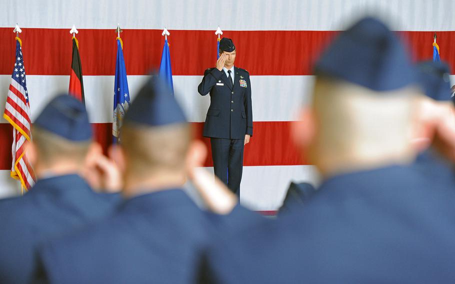 Col. Jeffrey L. Marker gives his airmen a first salute after taking command of the 603rd Air and Space Operations Center from Col. Peter F. Davey during the change of command ceremony at Ramstein Air Base, Tuesday.