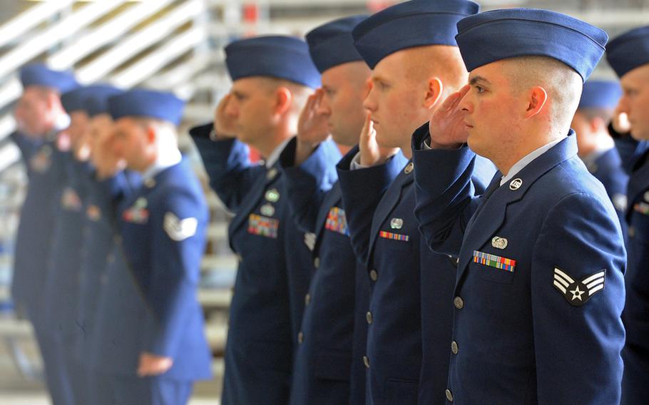 Airmen of the 603rd Air and Space Operations Center salute during the units change of command ceremony at Ramstein Air Base Tuesday.  Col. Jeffrey L. Marker took command of the 603rd from Col. Peter F. Davey at the ceremony.
