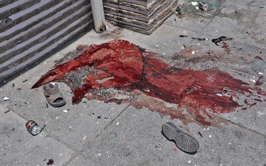 The blood stain of a victim of an insurgent attack on a lakeside resort in Kabul that ended Friday morning with 18 people dead, including 14 civilians.