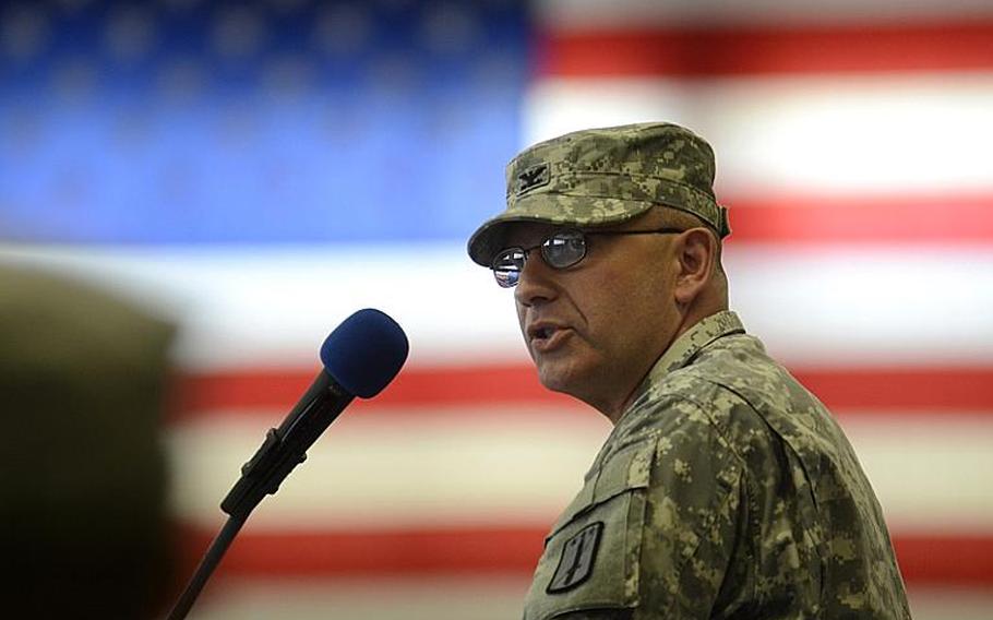 U.S. Army Col. Mark Raschke, incoming commander of the 170th Infantry Brigade Combat Team, speaks to soldiers and guests Tuesday in Baumholder, Germany, as he formally assumes command of the unit.