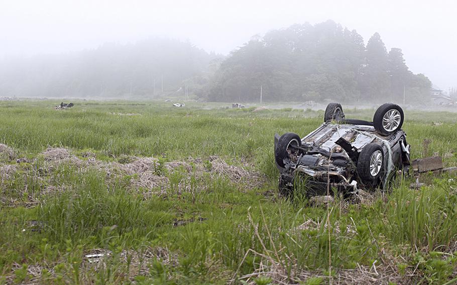 More than a year after the March 2011 earthquake and tsunami, wreckage from the disaster litters Minamisoma, a town in Japan's Fukushima prefecture.