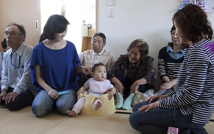 Kino Ueno, second from left, worries that she and her fellow residents at the Terauchi Dai-ni temporary housing area in Fukushima Prefecture have come to rely too much on support from volunteers and relief organizations.