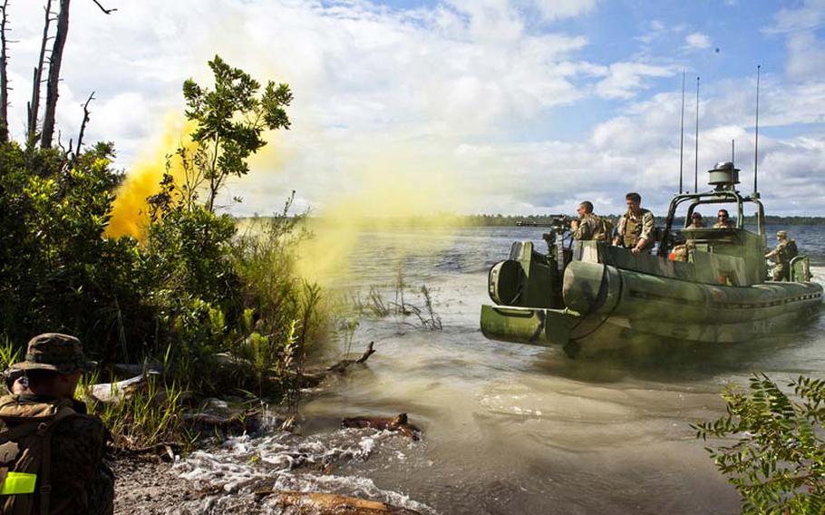 Sailors from the U.S. Navy's Riverine Squadron 3 coast into shore to extract a squad of Marines while conducting riverine training during UNITAS-Partnership of the Americas 2012 on Sept. 8, 2012, at Camp Blanding, Fla.