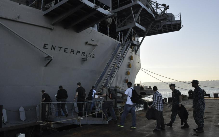 Sailors return to the USS Enterprise after visiting Naples, Italy. The ship arrived Tuesday in the Gulf of Naples, its final stop before heading to Virginia, where an inactivation ceremony will be held on Dec. 1.