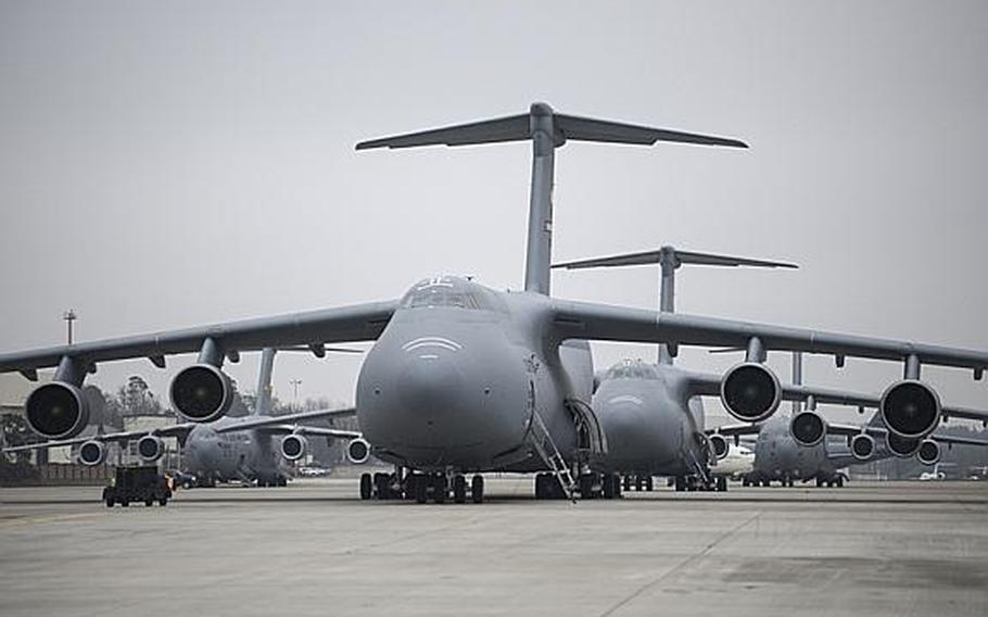 C-5 Galaxy aircraft line up on the flight line of Ramstein Air Base, Germany, as U.S. troops who will serve as the command-and-control element for U.S. Patriot missile batteries deploying to Turkey were delayed for a second day due to plane issues, on Tuesday, Jan. 8, 2013.