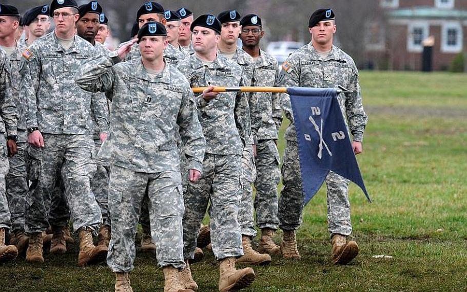 Soldiers salute while passing in review during a change of command ceremony at Fort Knox, Ky., in March 2012. A recently released Army study looks at ways to realign major Army posts in the United States based on a plan to reduce the Army's active duty end-strength from 562,000 to 490,000 by Fiscal 2020.