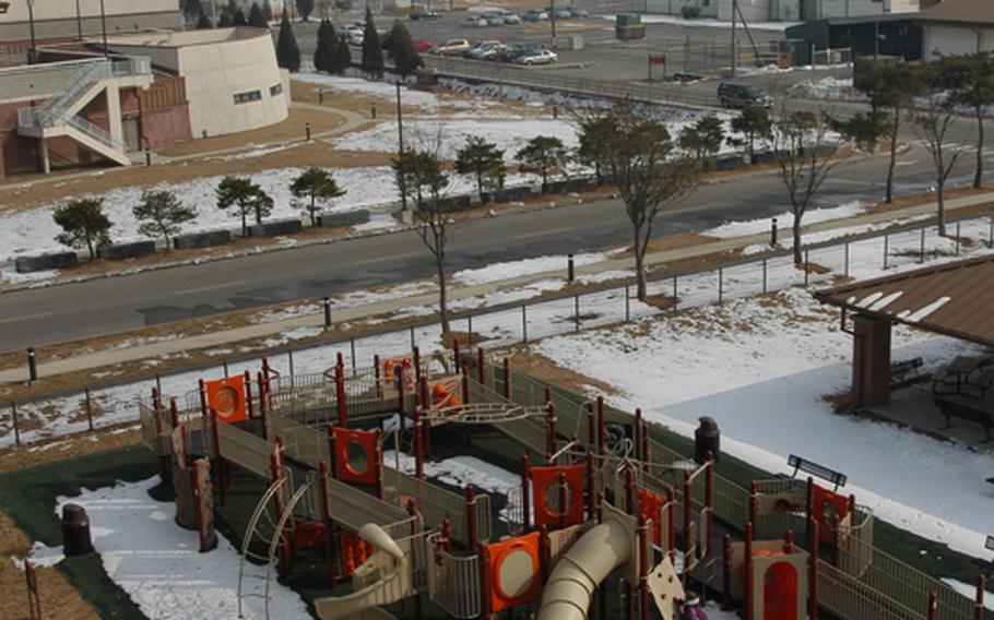 A lone child plays on a playground at Camp Humphreys in South Korea Thursday. Facilities at the base are expected to get more crowded in the years ahead as the U.S. military consolidates its troops here to two regional hubs south of Seoul by 2016.