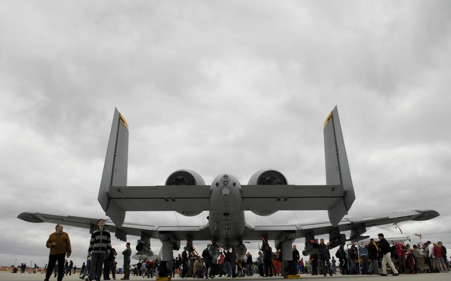 Spectators get a close look at an A-10 Thunderbolt II, nicknamed the Warthog, during the 2011 open house and aerial demonstration at Spangdahlem Air Base, Germany. This year's edition of the event has been canceled due to budget constraints.