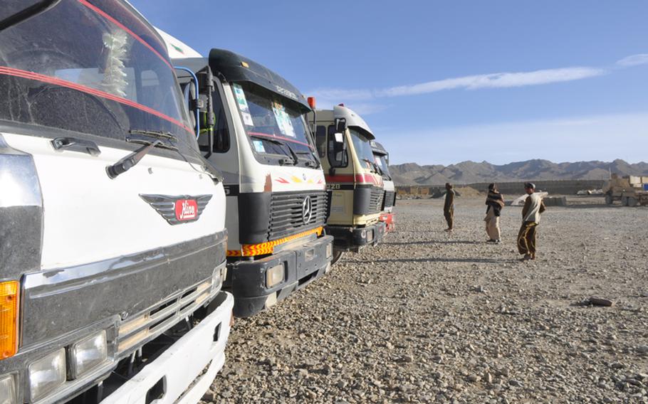 Afghan tractor-trailers line up waiting to enter Forward Operating Base Sweeney to load up with equipment. U.S. troops are packing up at FOB Sweeney and preparing to hand it over to the Afghan army.