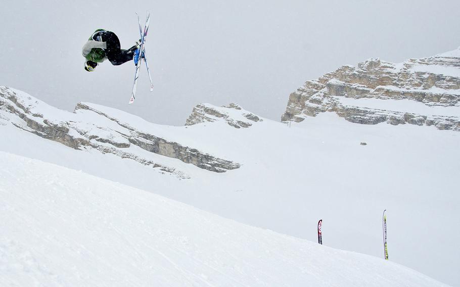 A skier executes a flip from a jump in a terrain park on the Zugspitze glacier ski area near Garmisch-Partenkirchen, Germany, on Apr. 8, 2012.