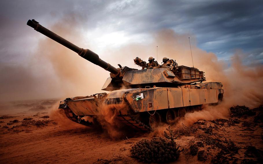 Marines from 4th Tank Division, Twentynine Palms, Calif., roll down a dirt road on their M1A1 Abrams Main Battle Tank during a day of training at Exercise Africa Lion on April 13, 2012.