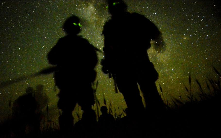 U.S. Army soldiers with the 1st Battalion, 501st Infantry Regiment deployed to Combat Outpost Sabari, Afghanistan, scan their area as they begin a multi-day air assault mission near the Pakistani border of eastern Afghanistan's Khost province May 2, 2012.