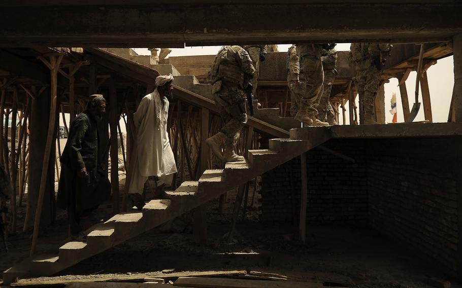 Members of Kandahar Provincial Reconstruction Team conduct a site survey of the Sanjaray bazaar May 24, 2012, in Kandahar, Afghanistan. Kandahar PRT is a joint team of U.S. Air Force, Army, Navy servicemembers and civilians deployed to the Kandahar province of Afghanistan to assist in the effort to rebuild and stabilize the local government and infrastructure.