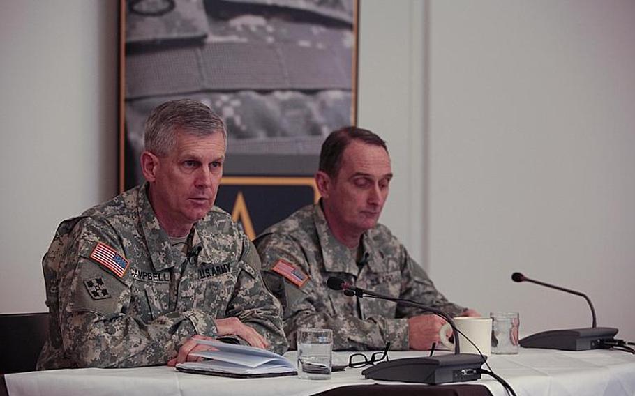 Lt. Gen. Donald M. Campbell Jr., commander of U.S. Army Europe, and Command Sgt. Maj. David S. Davenport Sr., the command's senior enlisted advise, answer questions at a media roundtable at Clay Kaserne in Wiesbaden, Germany, the command's new home.

Matt Millham/Stars and Stripes