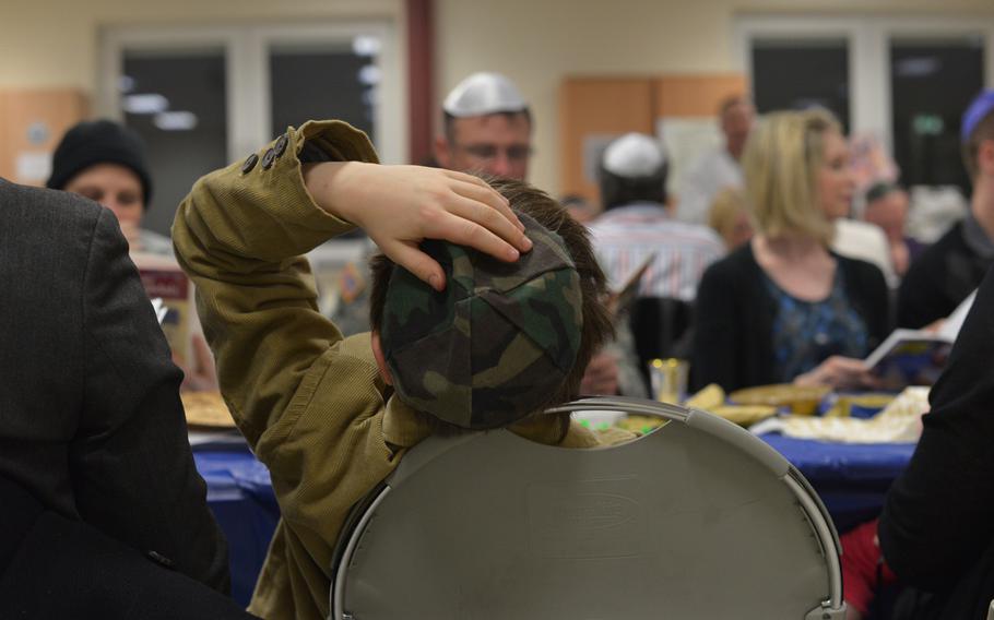 Maxwell Vindman, 9, adjusts his yarmulke during Monday's Passover Seder at U.S. Army Garrison Grafenwohr. Some 50 people attended the first of four Seders held by U.S. Army Europe's only Jewish chaplain, Capt. Andrew Shulman.