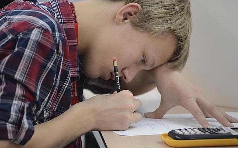 Justin Keller, an eighth-grade student from Ankara, works on a math problem during a MATHCOUNTS state compeition March 28, 2013, in Wiesbaden, Germany. A total of 52 middle school students participated in the state competition for Department of Defense Dependents Schools in Europe and the Pacific.