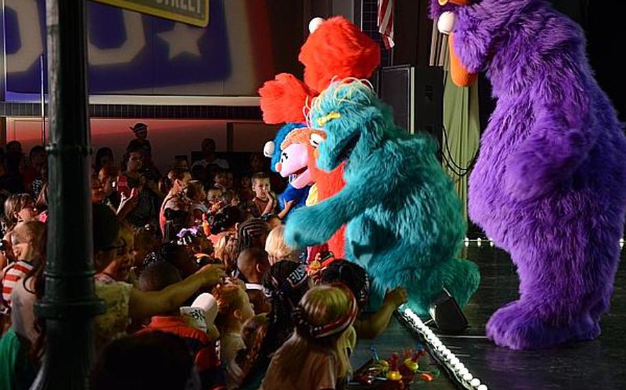 "Sesame Street" characters greet children during a show Friday, July 5, 2013, at Aviano Air Base, Italy.

Jason Duhr/Stars and Stripes