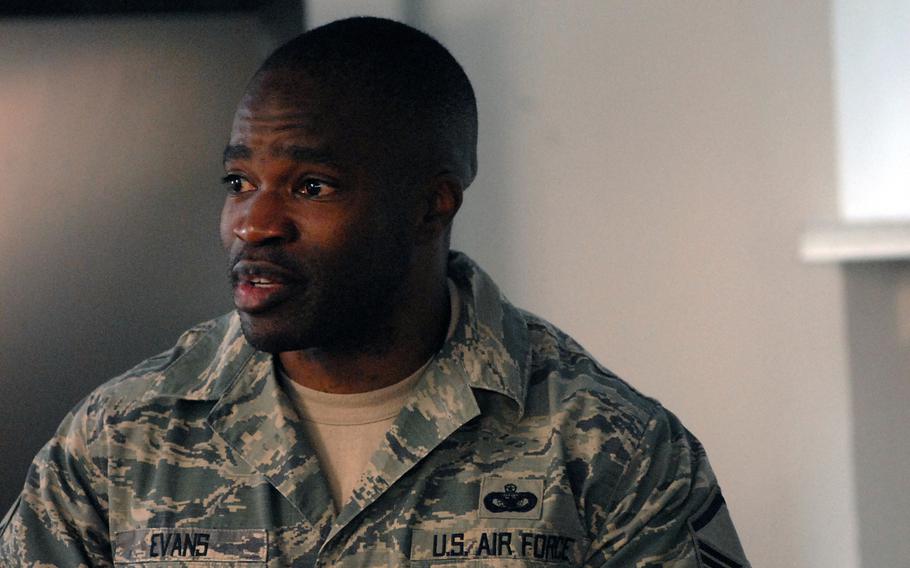 Air Force Master Sgt. Lloyd Evans, a security forces dog handler, wells up while speaking at the Air Force Deployment Transition Center's third anniversary ceremony on Tuesday. Evans shared his story of the struggles he experienced after returning from a deployment in Iraq and how working at the center helped him cope.