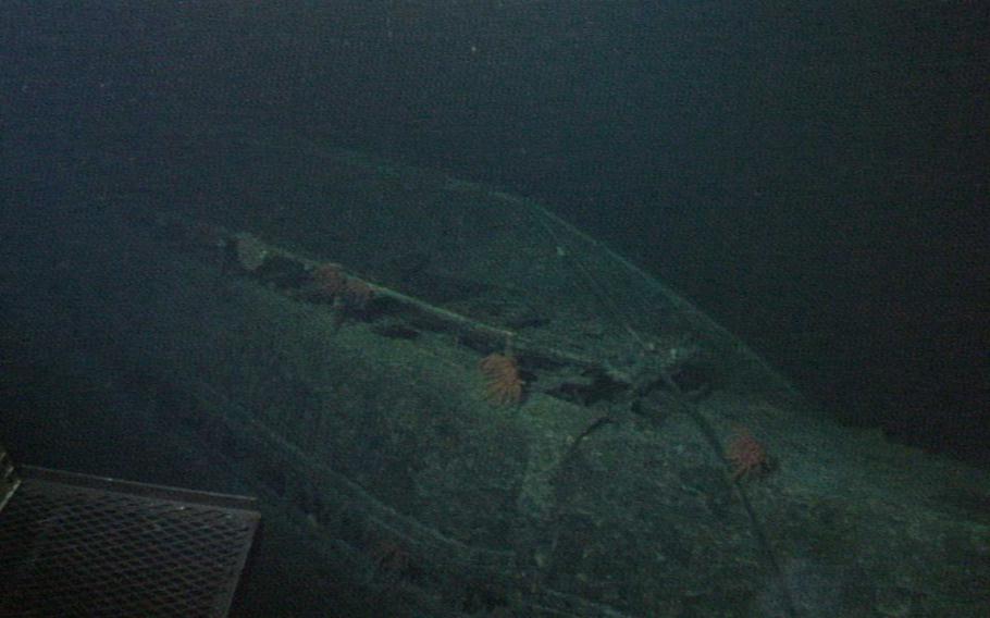 The hulking hull of the I-400 comes into view from the depths. When it was completed in 1944, the submarine was the largest ever built at 400-feet long with a surface displacement of 3,530 tons - a record that stood until the nuclear-powered subs of the 1960s. The submarine had a range of 37,500 miles and was able to travel around the world one and a half times before it needed refueling, something that remains unmatched to this day by any other diesel-electric submarine.