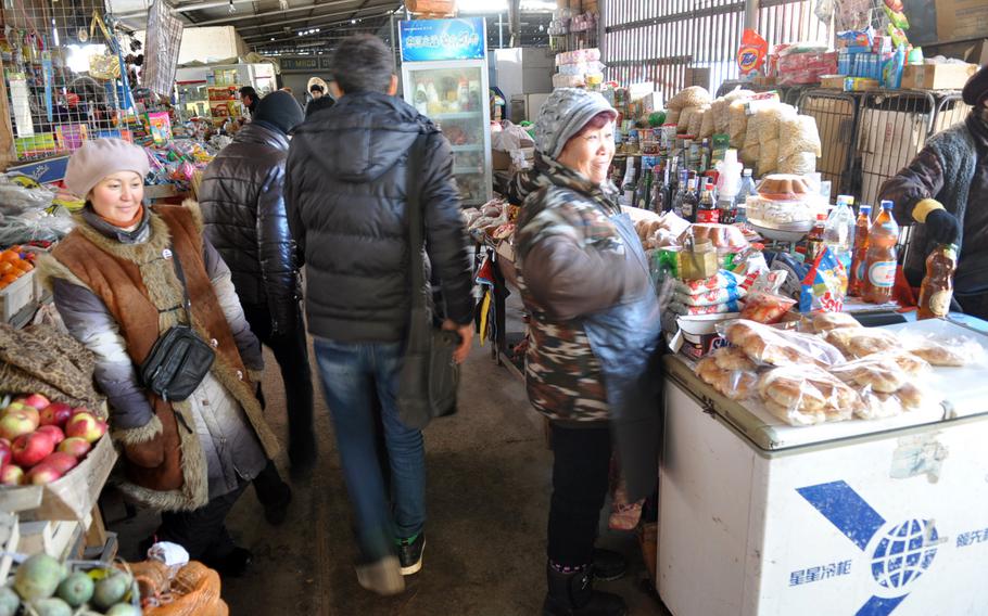 Shopkeepers at a market near the U.S. Air Force transit center in Manas, Kyrgyzstan, laugh when asked about pollution and other potential problems caused by the base. They acknowledge the problems but insist they would rather have the jobs and money the American presence brings.