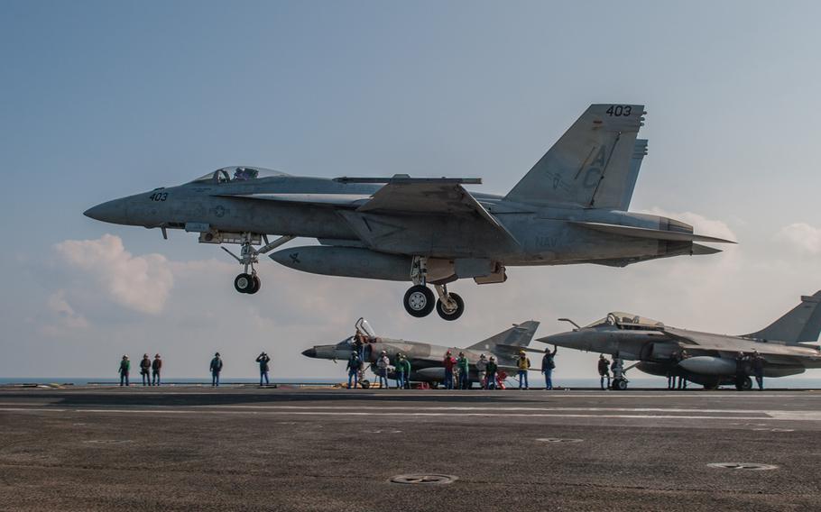An F/A-18E Super Hornet, assigned to the "Gunslingers" of Strike Fighter Squadron 37, lands aboard the aircraft carrier FS Charles de Gaulle Jan. 13, 2014, in the Persian Gulf. 