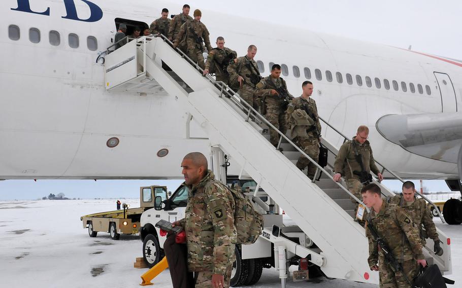 Soldiers from the 2nd Brigade Combat Team, 101st Airborne Division, arrive at Mihail Kogalniceanu Air Base in Romania on Feb. 2, 2014. The soldiers were the first wave of passengers to transit through MK Air Base en route to a mission in Southwest Asia.
