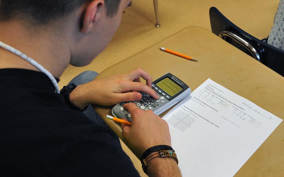 Giorgio Correa, a Ramstein 10th-grader, works on a problem in a recent "flipped mastery" algebra class.