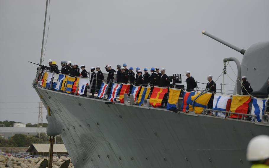 Sailors aboard the guided-missile destroyer USS Donald Cook  man the rails as the ship arrives in Rota, Spain, on Tuesday, Feb. 11, 2014. 