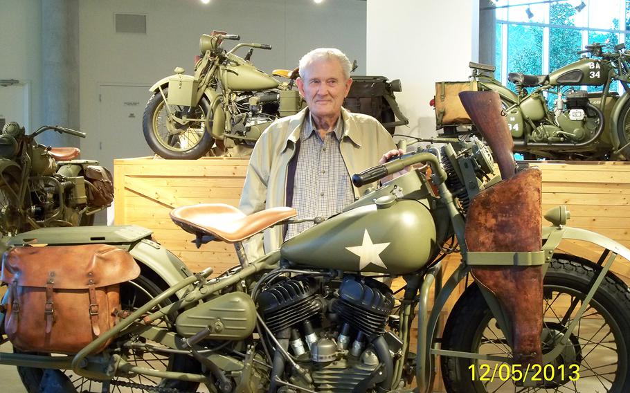Bill Burton, 89, stands next to a military Harley, identical in vintage to the one he rode while a soldier in World War II. When he was issued that bike, it was named ???Ginny,??? which was his mother???s name.