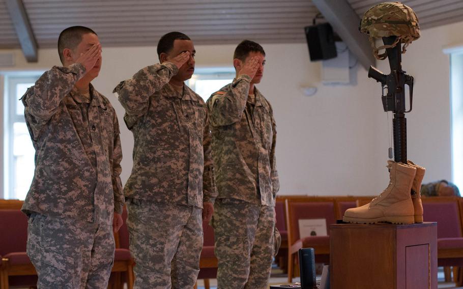 The 2nd Cavalry Regiment says goodbye to Chief Warrant Officer 2 Edward Balli at a memorial service on Feb. 12, 2014.