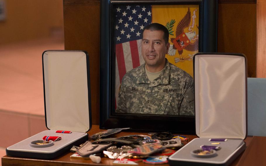 A portrait of Chief Warrant Office 2 Edward Balli and his medals were displayed at his memorial service in Vilseck on Feb. 12, 2014.