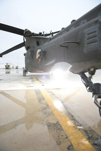 A Black Hawk flashes its lights during maintenance and testing while parked on the tarmac at Kandahar Air Field, Afghanistan, in this undated file photo.