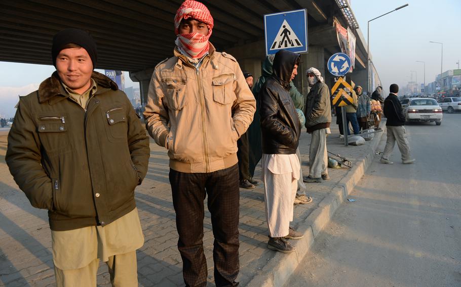 7:20 a.m. Day laborers wait for work in the Kot-e Sangi neighborhood in west Kabul. 