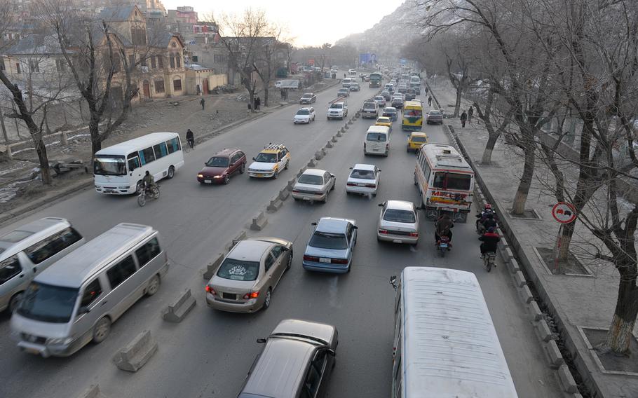 7:51 a.m. Rush-hour traffic in central Kabul. The city was built for about 500,000 people and has swelled to a population of 5 to 6 million, badly straining the road system. 