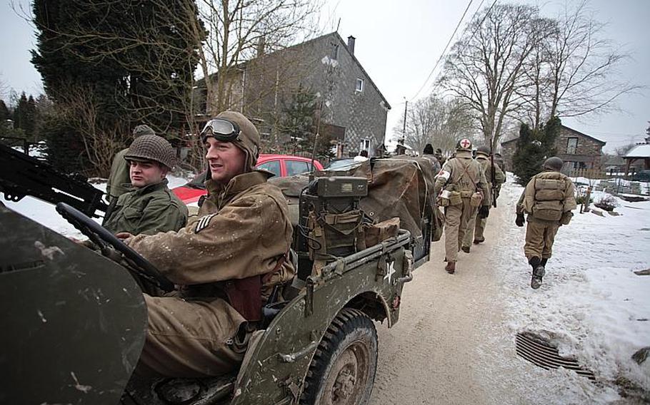 Re-enactors march down the road outside Basse-Bodeux, Belgium, as a jeep zips by in the other direction during the annual In the Footsteps of the 82nd Airborne Division walk on Feb. 23, 2013. This year, the walk starts in Bra, Belgium, honoring the unit's 504th Parachute Infantry Regiment. 

Matt Millham/Stars and Stripes