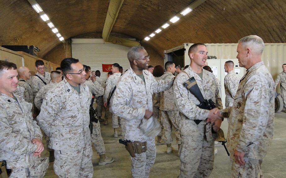 Commandant Gen. James Amos meets with Marines of R4OG after presenting an award to the unit Tuesday.